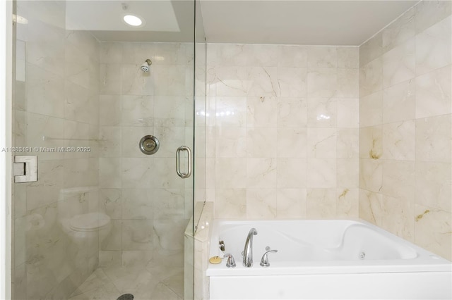 bathroom with shower with separate bathtub