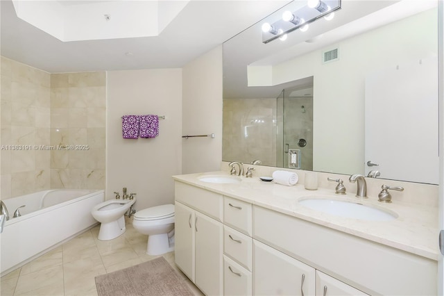6365 Collins Ave Unit 907, Miami Beach, FL 33141 - full bathroom featuring a bidet, double vanity, tile patterned flooring, and a skylight