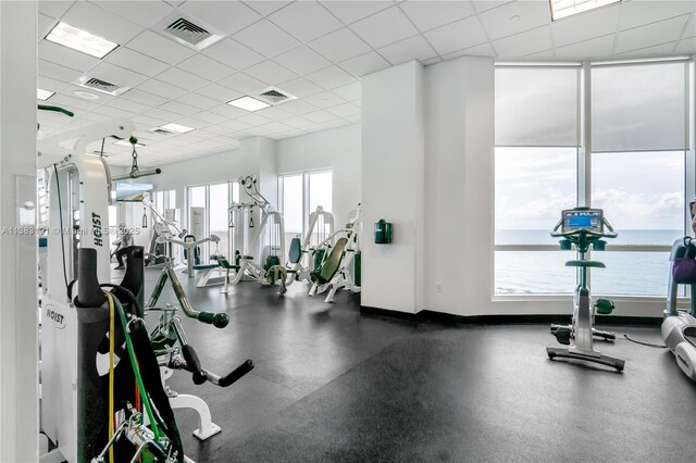 6365 Collins Ave Unit 907, Miami Beach, FL 33141 - gym with baseboards and a drop ceiling
