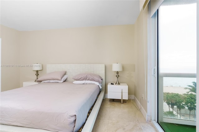 tiled bedroom with multiple windows and a water view