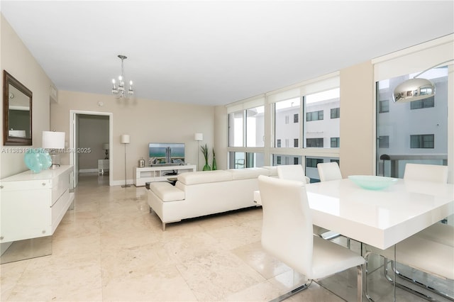 living room with an inviting chandelier and floor to ceiling windows