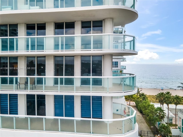 view of building exterior with a water view