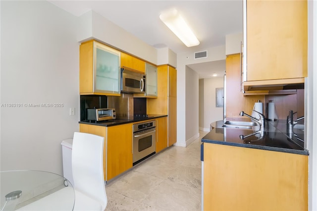 kitchen with appliances with stainless steel finishes and sink