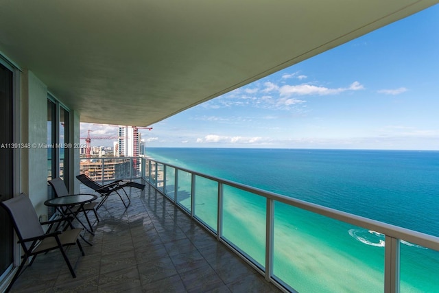 balcony featuring a water view