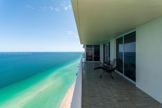 balcony featuring a water view