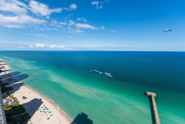 bird's eye view with a view of the beach and a water view