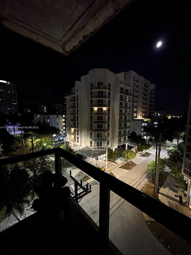 view of balcony at twilight