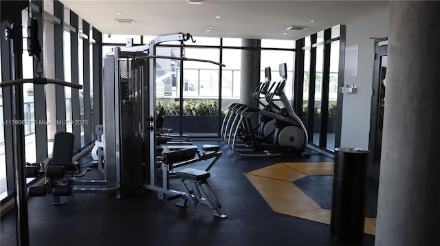 gym with a wall of windows