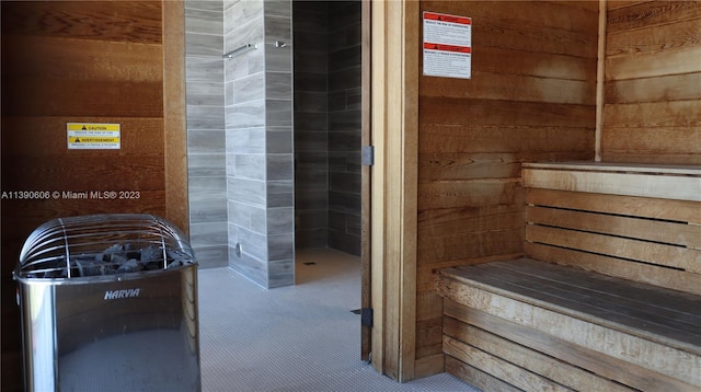 view of sauna with wood walls