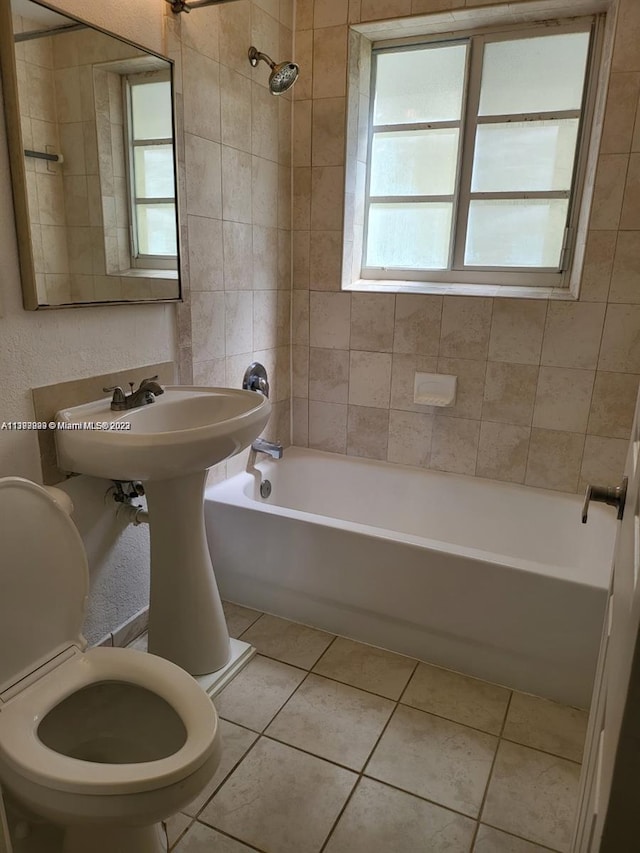 bathroom with tile patterned flooring and tiled shower / bath combo