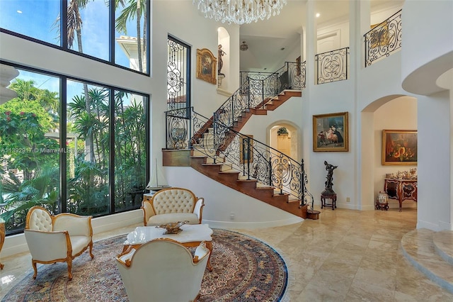 interior space with an inviting chandelier and a towering ceiling