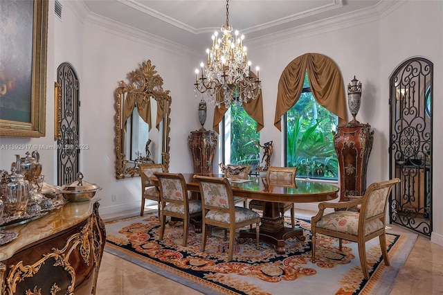 tiled dining room with a chandelier and ornamental molding