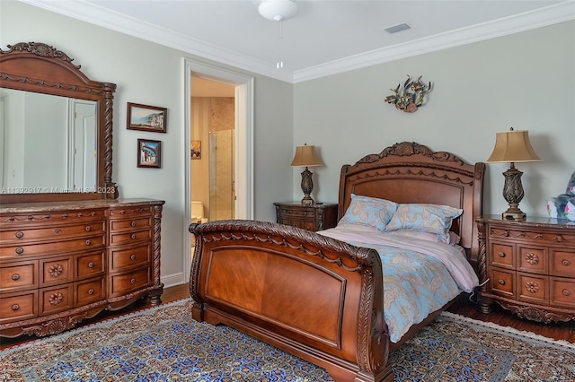 bedroom with ornamental molding, ensuite bathroom, and dark wood-type flooring