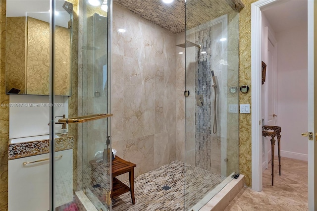 bathroom with tile floors and a shower with door