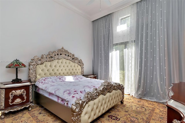 bedroom featuring crown molding and ceiling fan