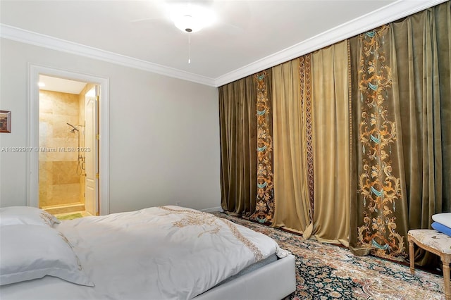 bedroom featuring ensuite bath, ornamental molding, and ceiling fan