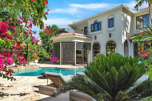 view of swimming pool with a patio area