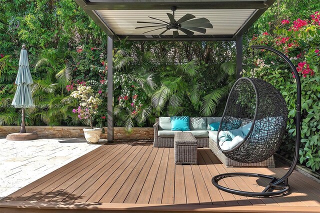 wooden terrace featuring ceiling fan