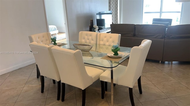 dining space featuring tile flooring