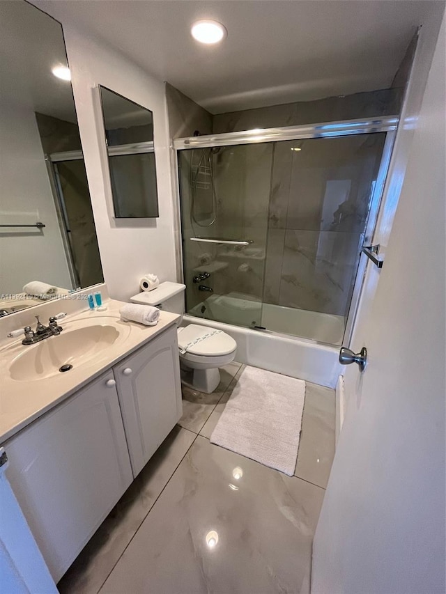 full bathroom featuring large vanity, toilet, enclosed tub / shower combo, and tile flooring