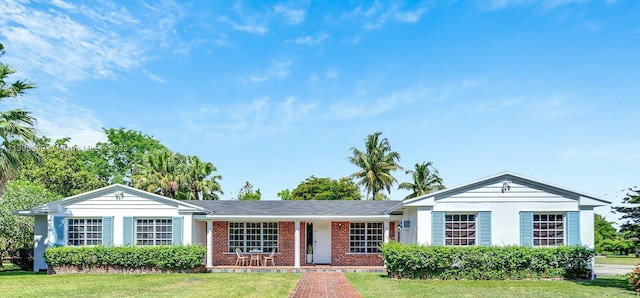 ranch-style home featuring a front yard