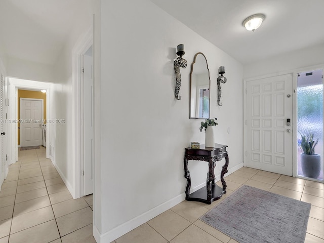 foyer entrance with light tile floors