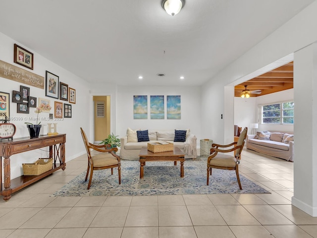 living room with ceiling fan and light tile floors