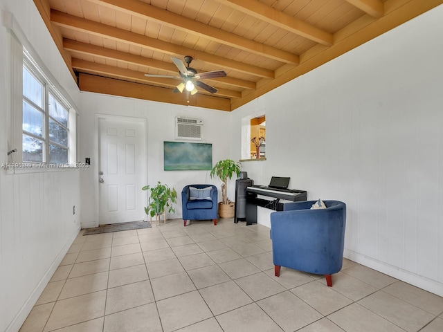 living area with beamed ceiling, ceiling fan, a wall unit AC, light tile flooring, and wooden ceiling