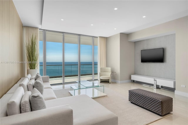 living room with a water view and expansive windows