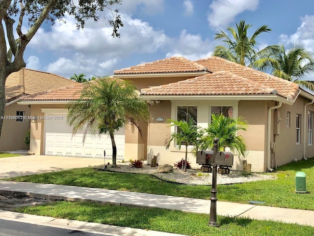 mediterranean / spanish-style house with a front lawn and a garage