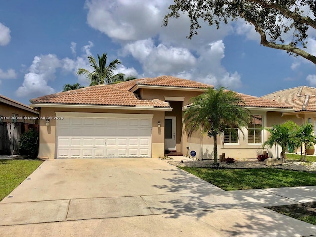 mediterranean / spanish-style home featuring a front yard and a garage