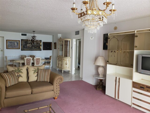 living room featuring an inviting chandelier, light carpet, and a textured ceiling