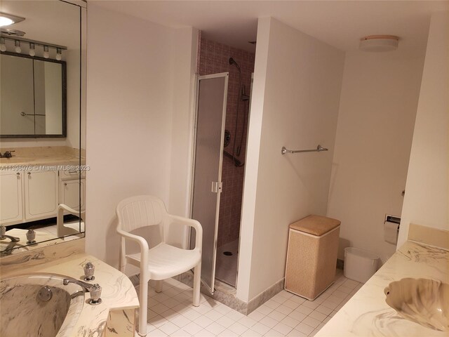 bathroom featuring tile flooring, separate shower and tub, and vanity