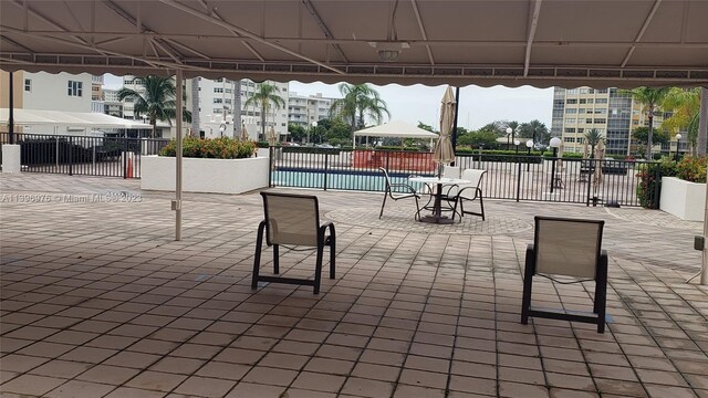 view of patio / terrace with a gazebo and a community pool