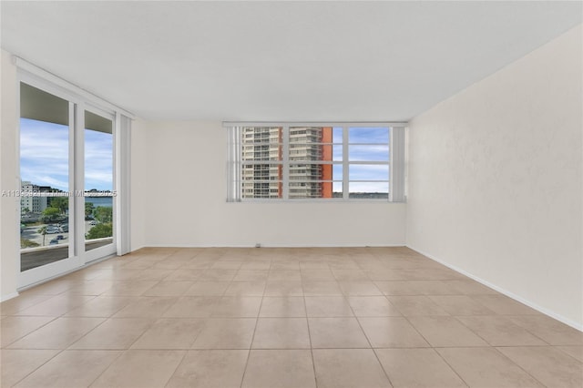 tiled empty room with baseboards