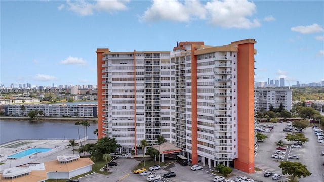 view of property featuring a view of city and a water view