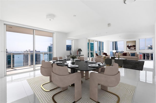 tiled dining space featuring floor to ceiling windows and a healthy amount of sunlight