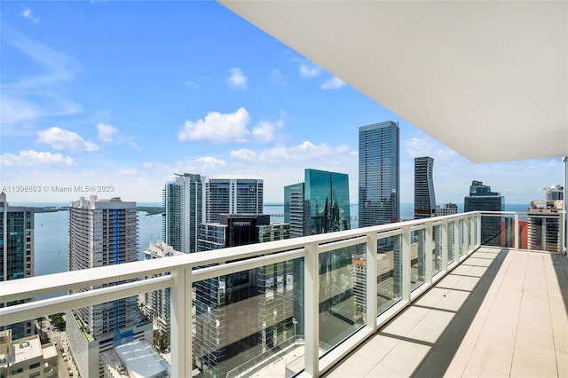 balcony featuring a water view