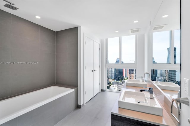 bathroom featuring dual bowl vanity and tile floors