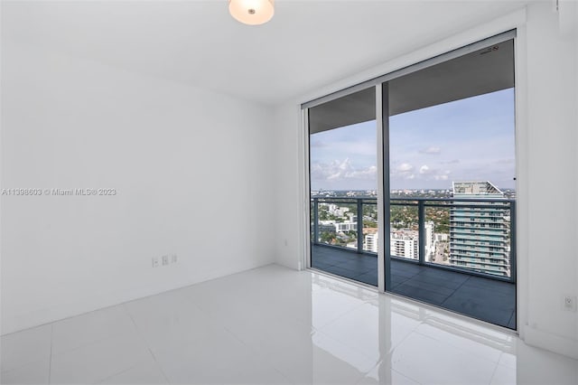 tiled empty room with expansive windows