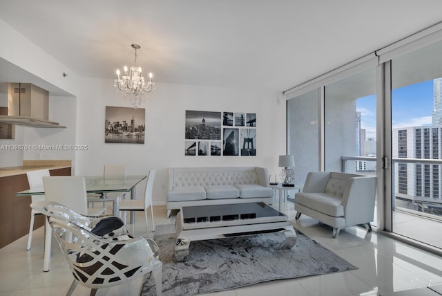 tiled living room featuring a notable chandelier and floor to ceiling windows