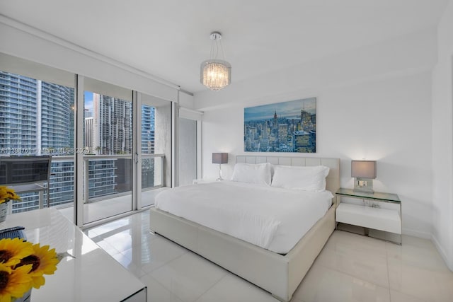 bedroom with floor to ceiling windows, access to exterior, an inviting chandelier, and light tile patterned flooring