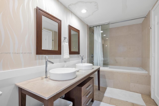 bathroom featuring tile patterned floors, vanity, and shower / bath combo with shower curtain