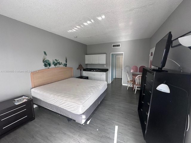 26 Diplomat Pkwy Unit 2342, Hallandale Beach, FL 33009 - bedroom featuring dark hardwood / wood-style floors, pool table, a textured ceiling, and sink