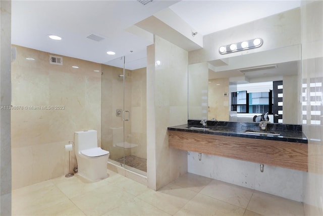 bathroom featuring toilet, tile walls, sink, and walk in shower