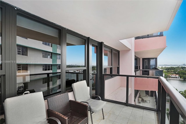 balcony featuring a water view