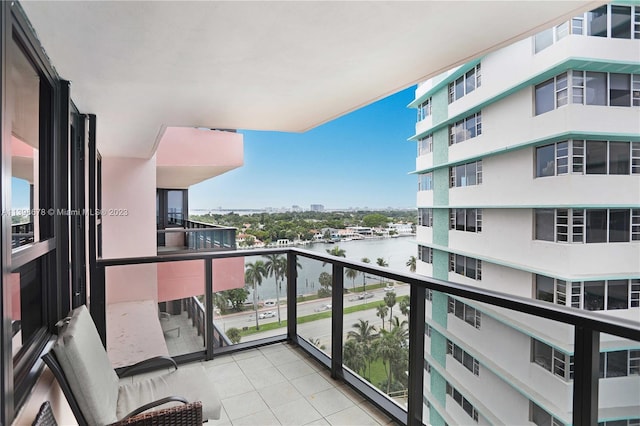 balcony featuring a water view