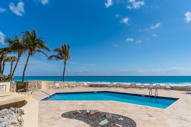 view of swimming pool with a patio area