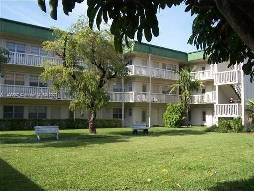 view of home's community with a yard