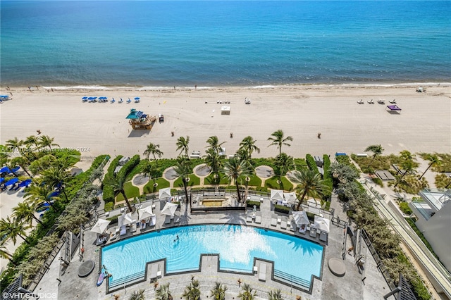 aerial view with a water view and a beach view